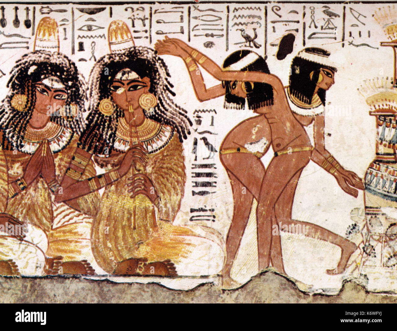 Ancient Egyptian dancing girls and flautist on wall-painting.  Double aulos. Stock Photo