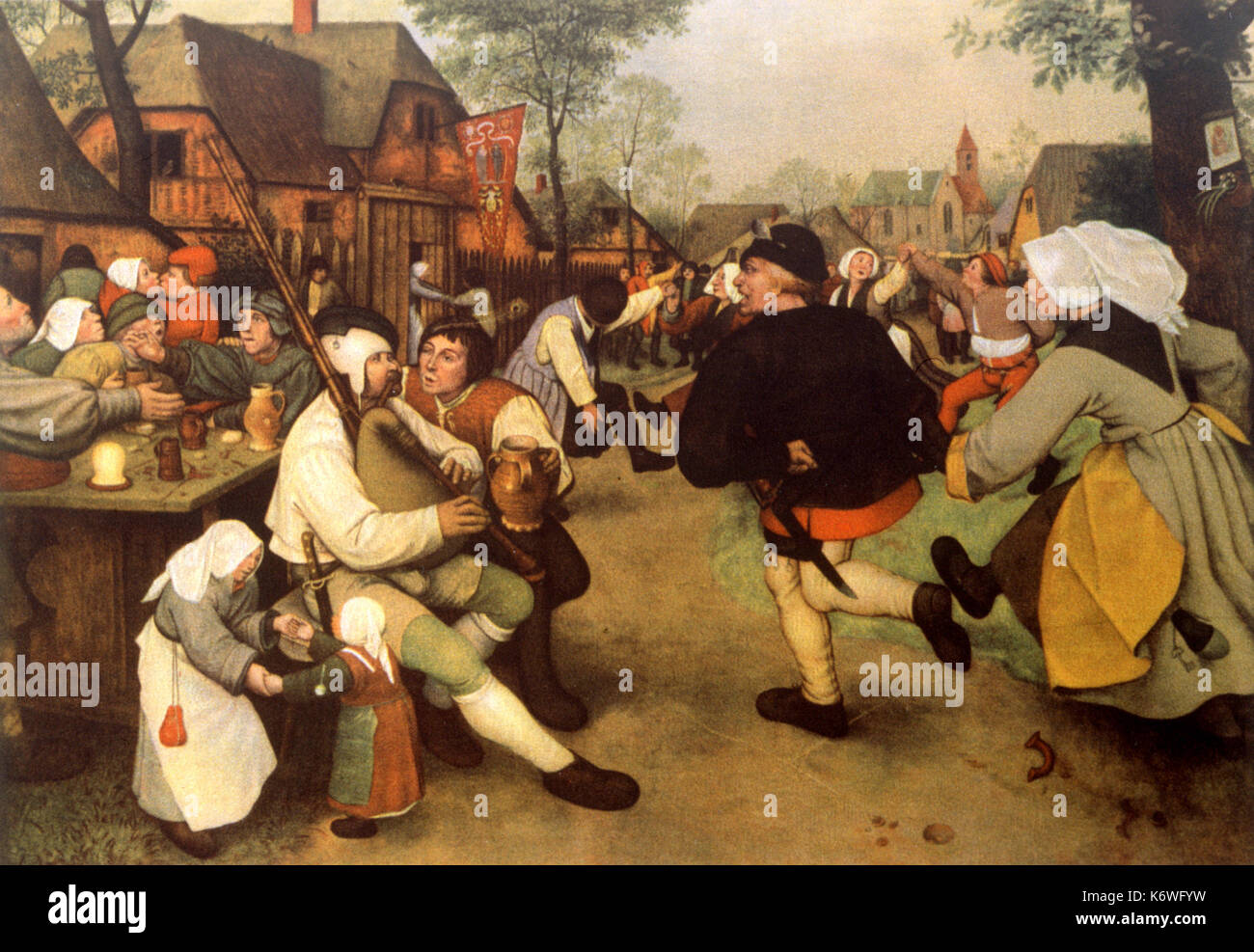 Flemish peasants dancing the Farandole in the open air,  to music played on bagpipes. After painting by Peter Brueghel the Elder.  Bagpipe player.  Bagpiper. Stock Photo