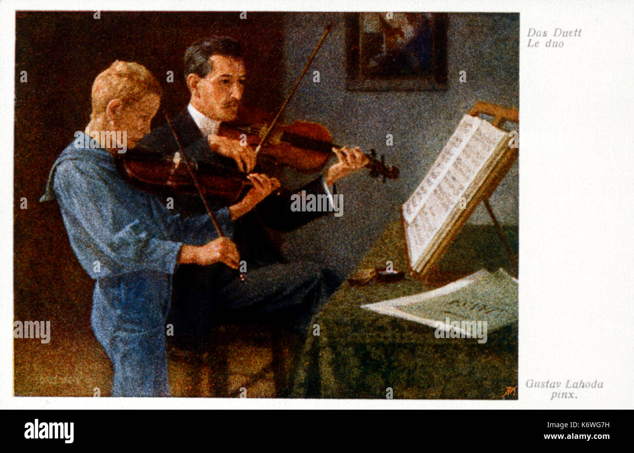 Violin duet between father/teacher & boy.  Playing from Score.   'Das Duett' by Gustav Laboda. Dates not known. Stock Photo