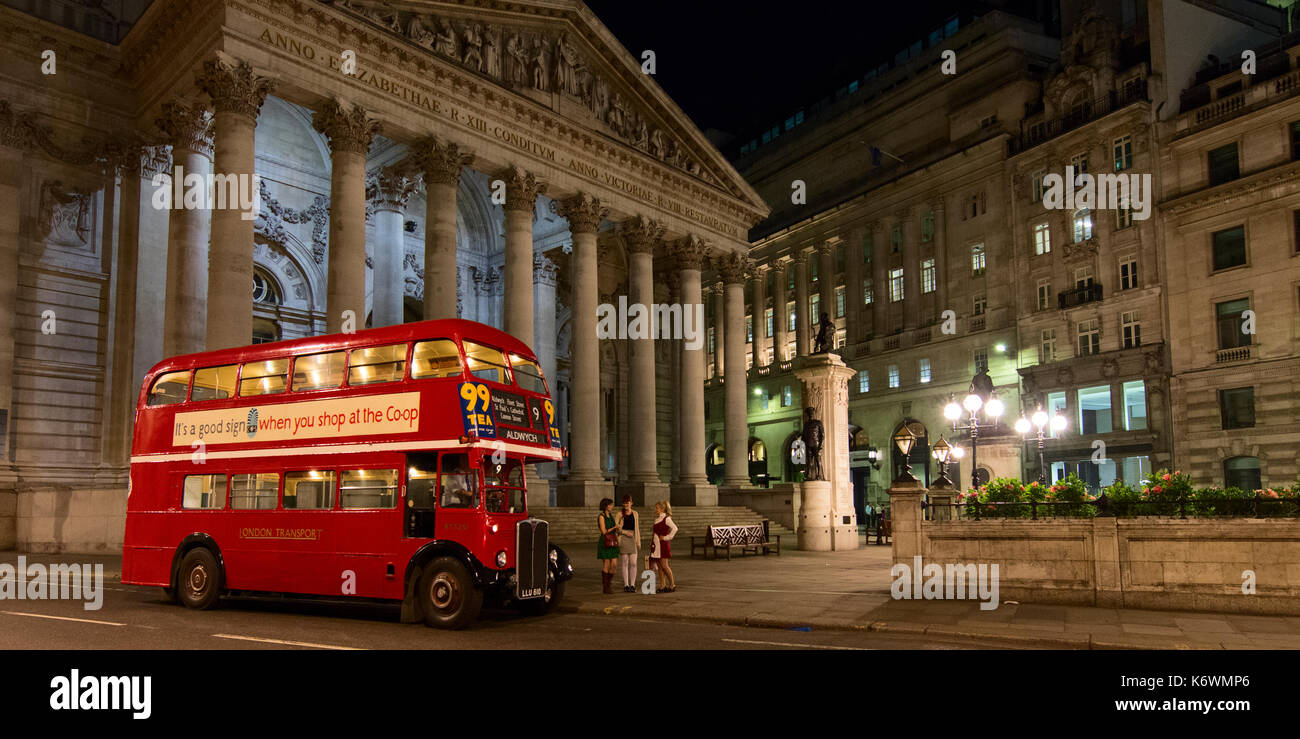Classic London Double Decker Red Bus at night in the City of London Stock Photo