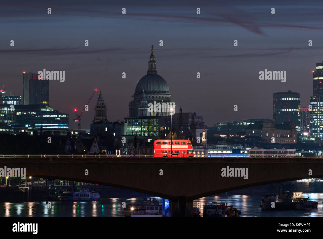 Vintage London Bus on Waterloo Bridge at Night Stock Photo