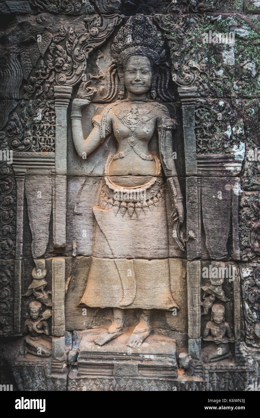 Stone relief of a divine dancer, apsaras, detail, ruined temple, Bayon Temple, Angkor Thom Complex, Angkor Archaeological Park Stock Photo
