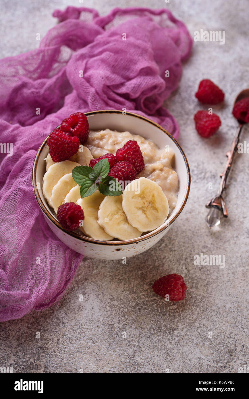 Oatmeal With Raspberry Oatmeal with raspberry and banana Stock Photo - Alamy