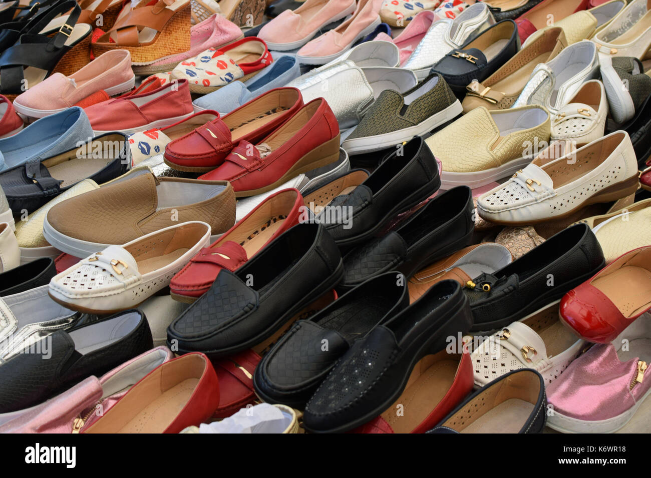 Flat shoes for women on sale at street market. Casual footwear. Stock Photo