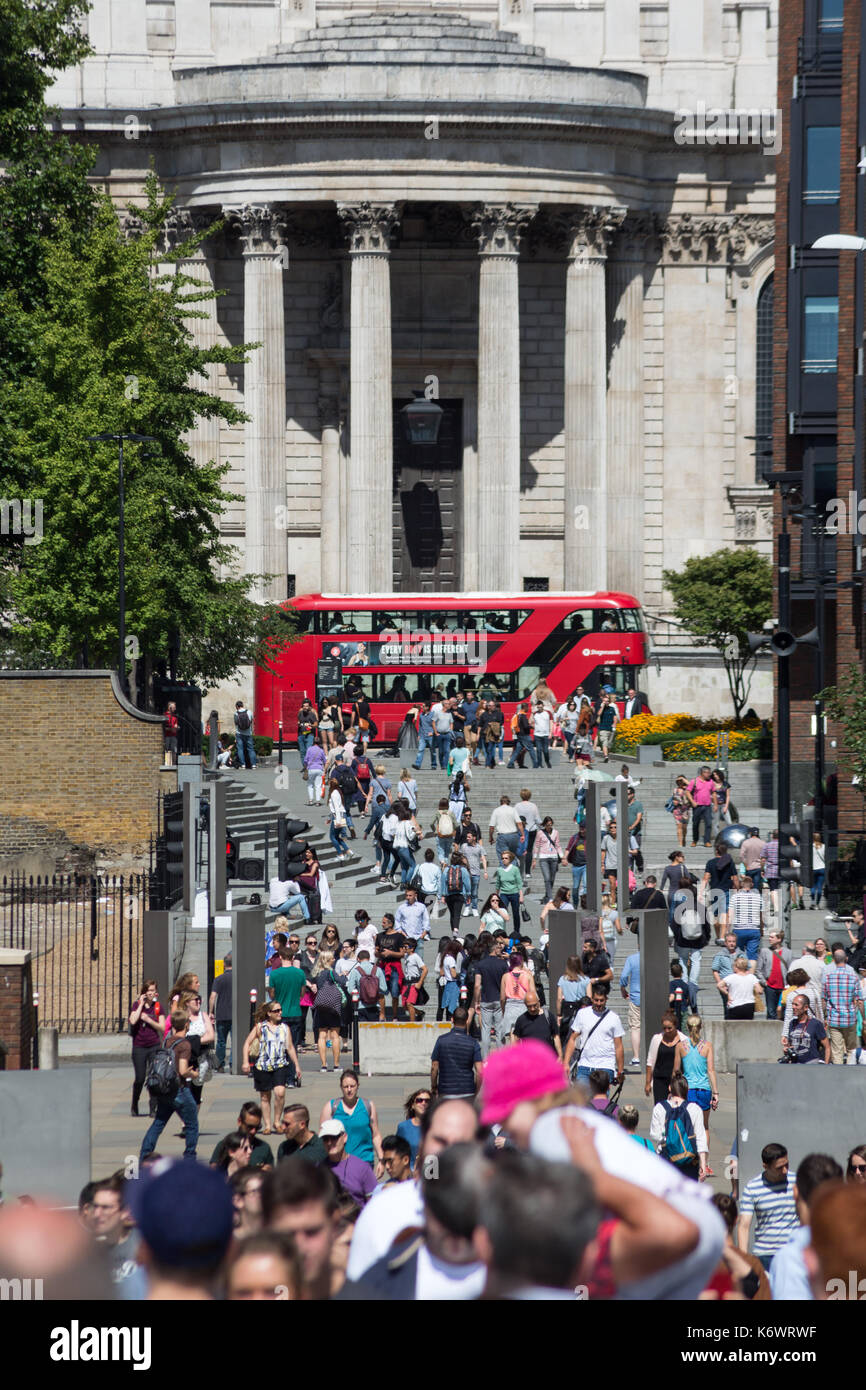 Crowds of people and tourists on steps between St Paul's Cathedral and Millennium Bridge, London, UK Stock Photo