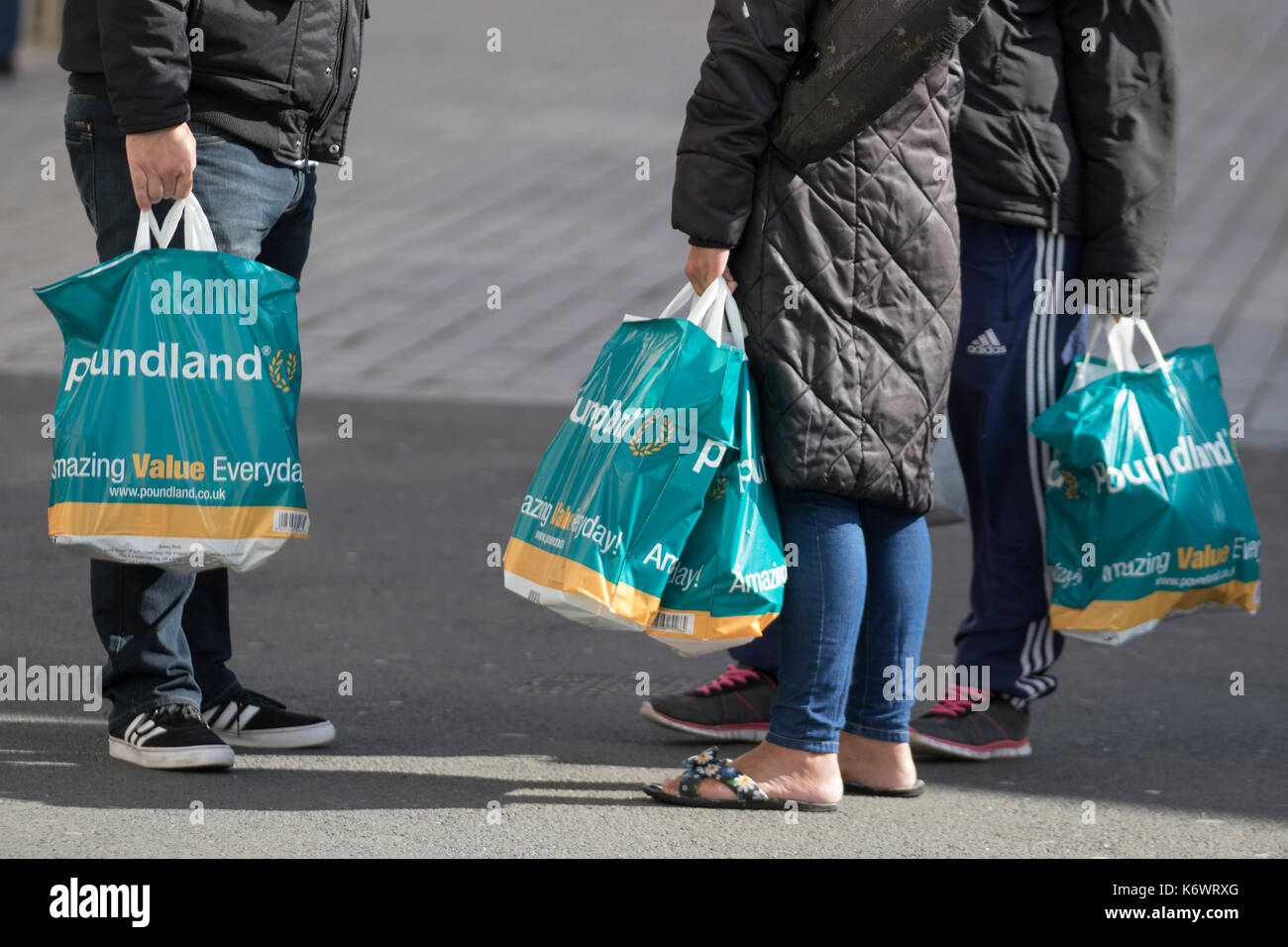 Shoppers with reusable bags from the Discount retail chain Poundland ...