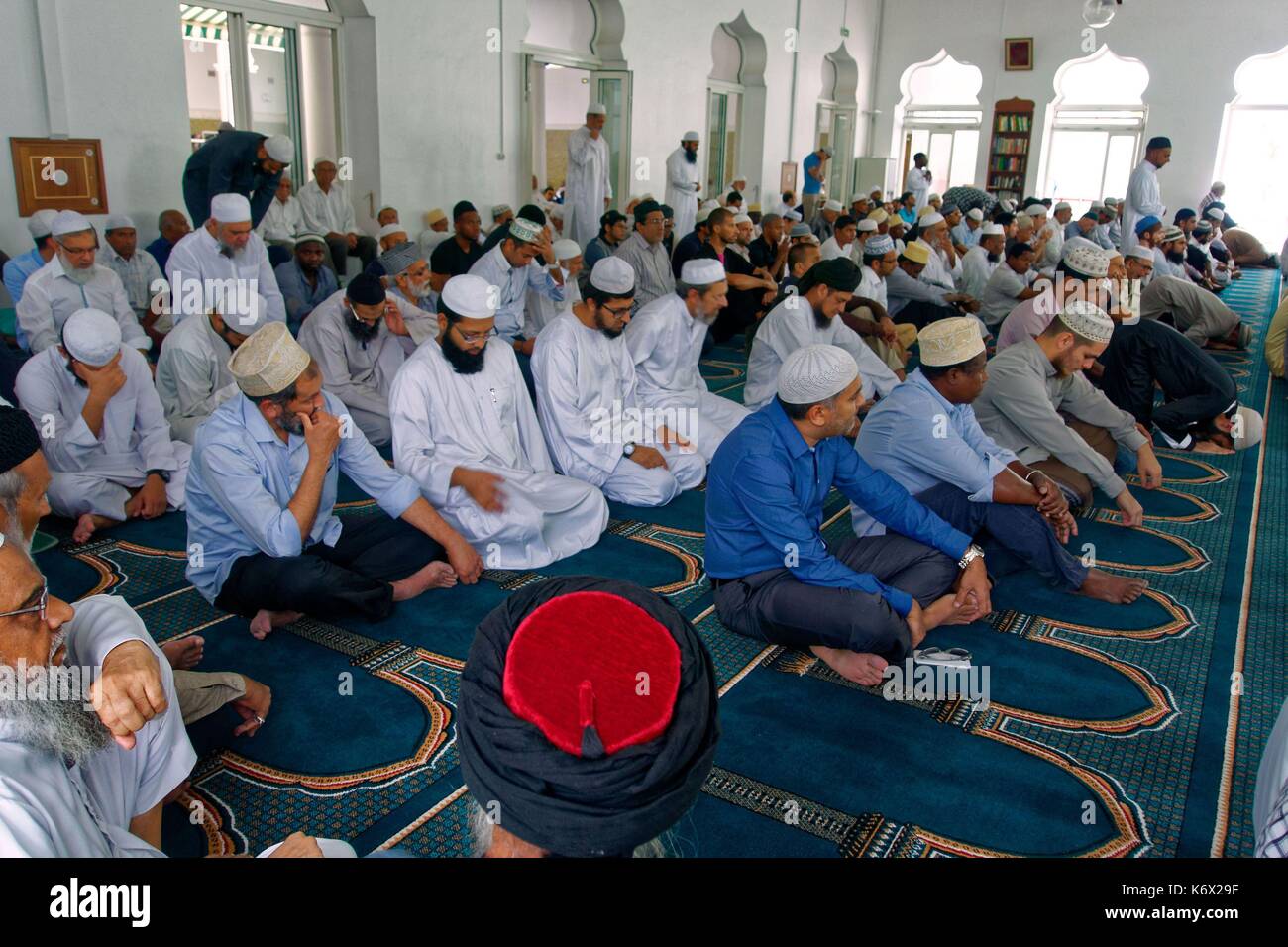 Men Before A Mosque High Resolution Stock Photography and Images