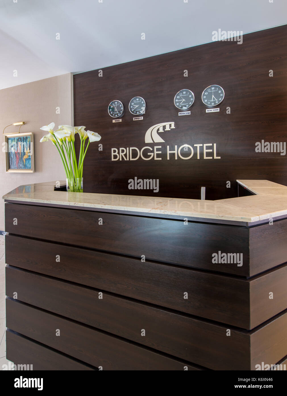 Hotel reception with desk and clocks Stock Photo Alamy