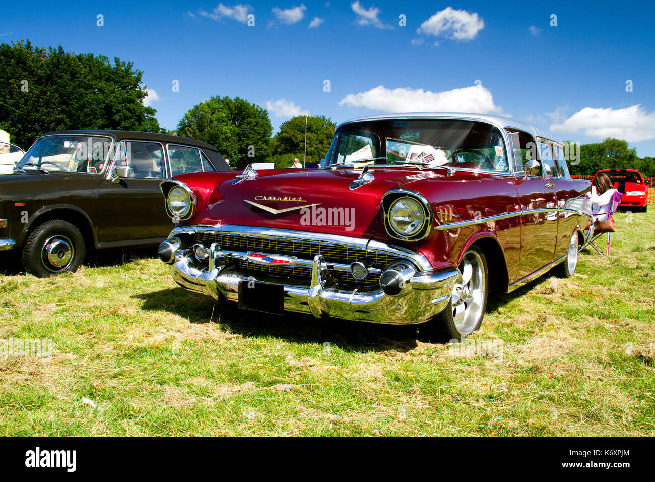 Front view of a maroon Chevrolet Bel Air on display at a classic car show in Wales, UK Stock Photo