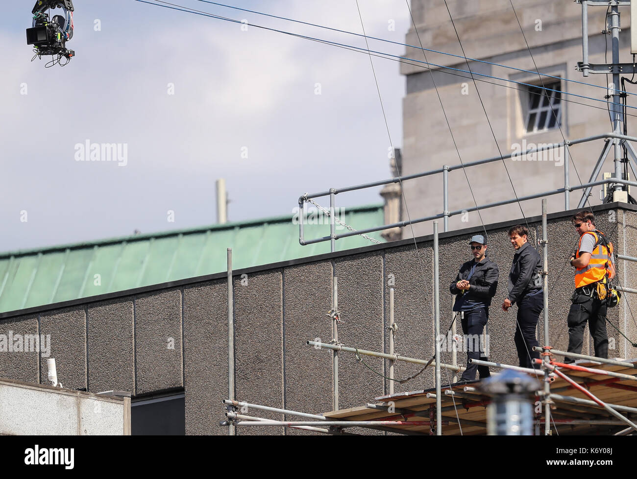 Tom Cruise jumps between two buildings in a scene from the new Mission Impossible film  The 55-year-old action man was injured during a big building-jump stunt on the set of the blockbuster in London on Sunday (13Aug17) - which was caught on camera. Cruise appeared to miss his mark while jumping from construction rigging onto a nearby building, and slammed gainst the wall. Clambering up the wall and getting to his feet, the movie star limped for a few yards and then collapsed in front of the film crew. Filming was halted as Tom was checked out by members of the on-set safety team. The footage  Stock Photo