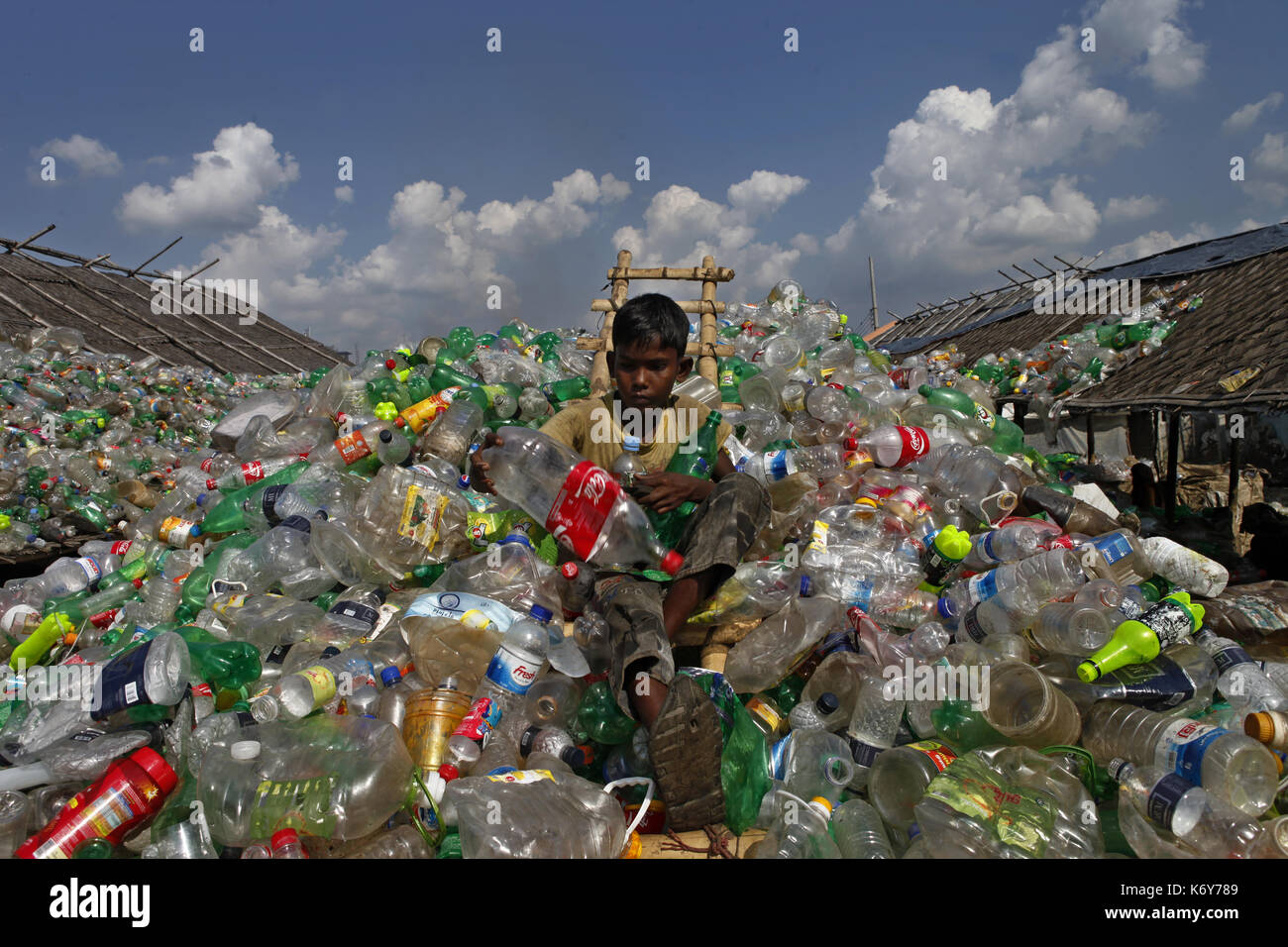 A boy works at a plastic recycling factory in Dhaka, Bangladesh on