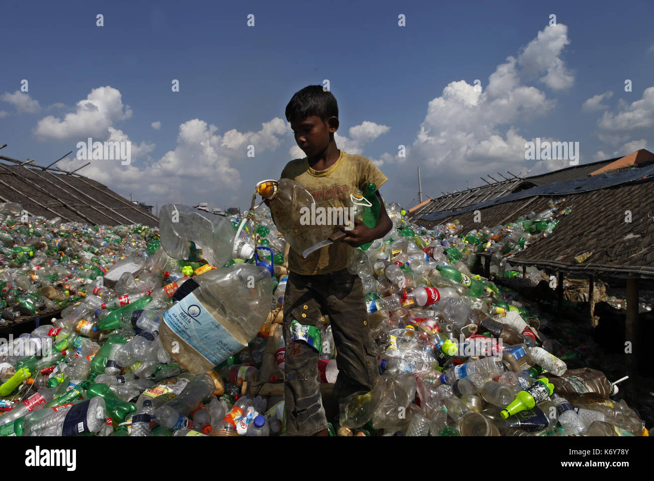 A boy works at a plastic recycling factory in Dhaka, Bangladesh on