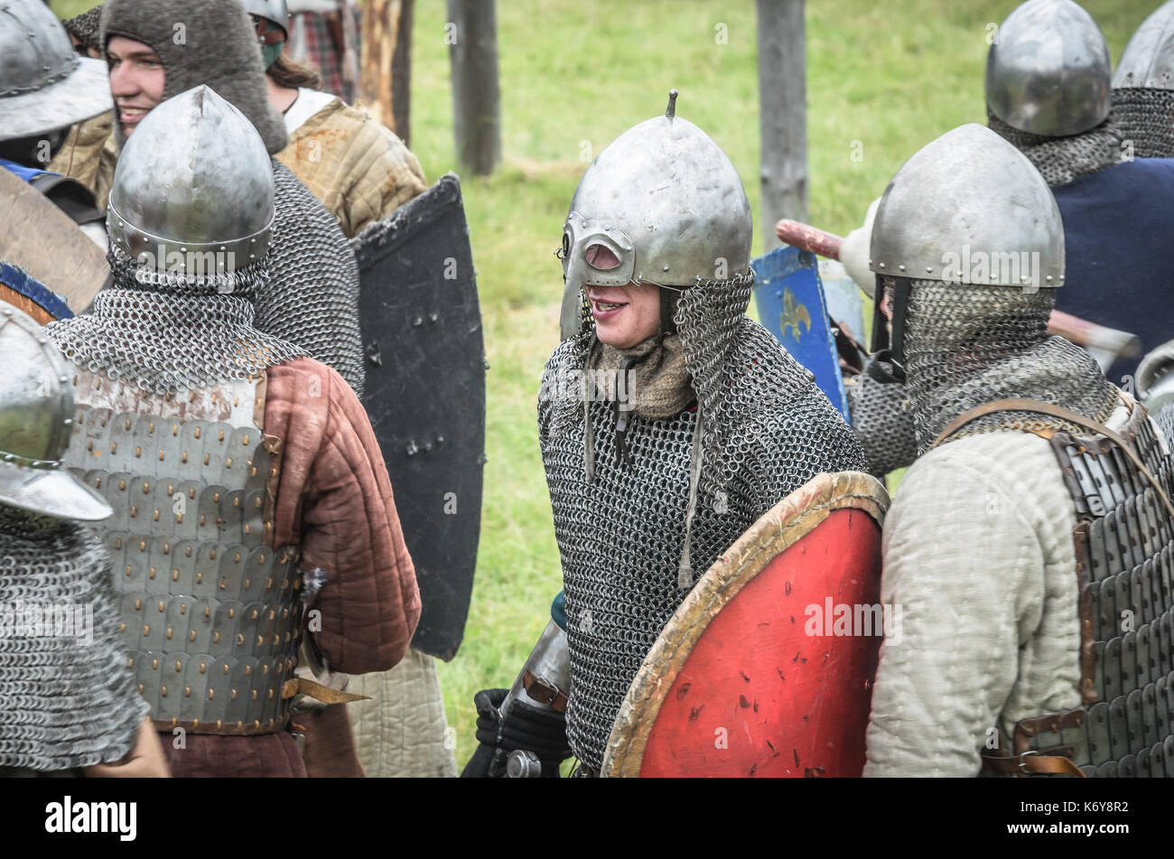 MOSCOW,RUSSIA-June 06,2016: Armored warriors in ancient costumes fighting on battlefield. Stock Photo