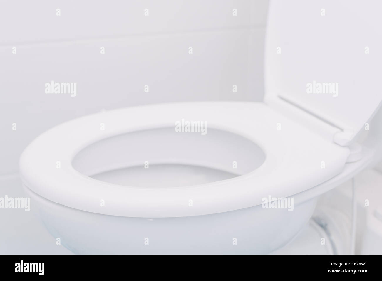 White toilet seat in bathroom, selective focus with copy space Stock Photo