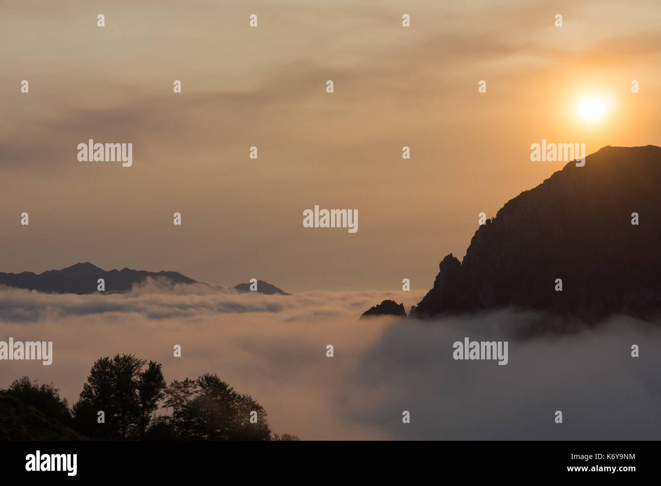 Early morning sunrise over a cloud inversion in the Cabrales valley, Asturias, Spain. Stock Photo
