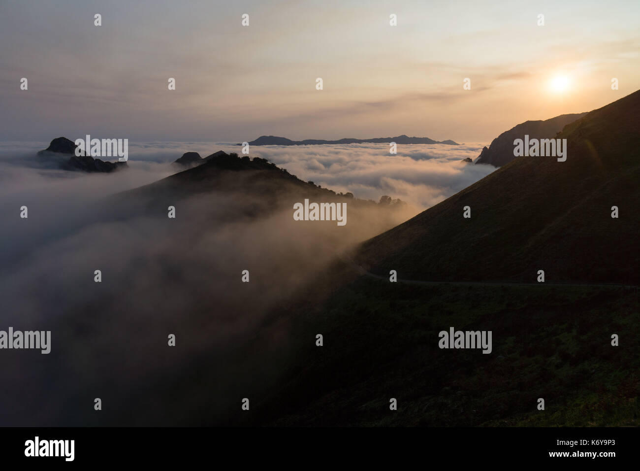 Early morning sunrise over a cloud inversion in the Cabrales valley, Asturias, Spain. Stock Photo