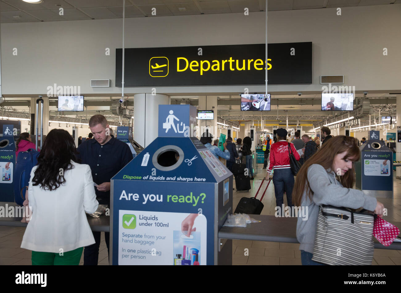 Passengers go through the departure gates at the North Terminal at Gatwick Airport Stock Photo