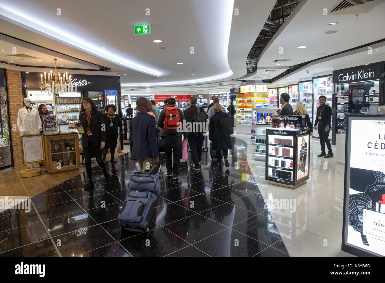 Passengers walk through the Duty Free section at the North Terminal at