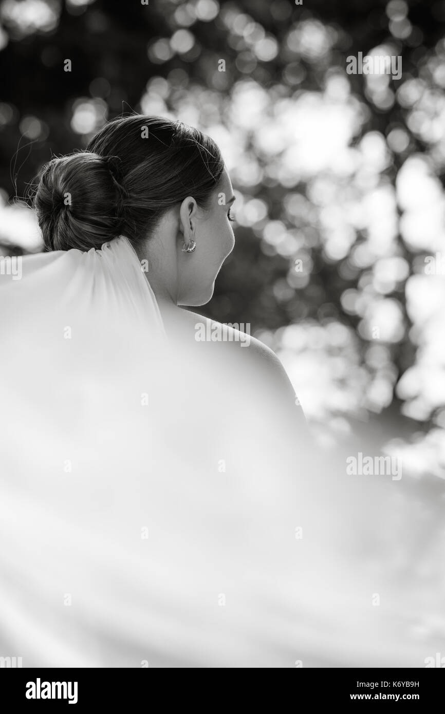 Black and white portrait of a bride from behind Stock Photo