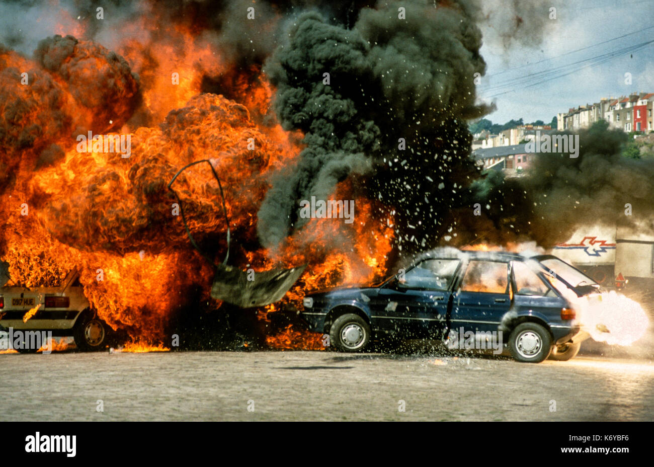 A still of two cars exploding from the set of the 1988 TV mini series Codename Kyril. Edward Woodward starred in the show which was shot in Bristol Stock Photo