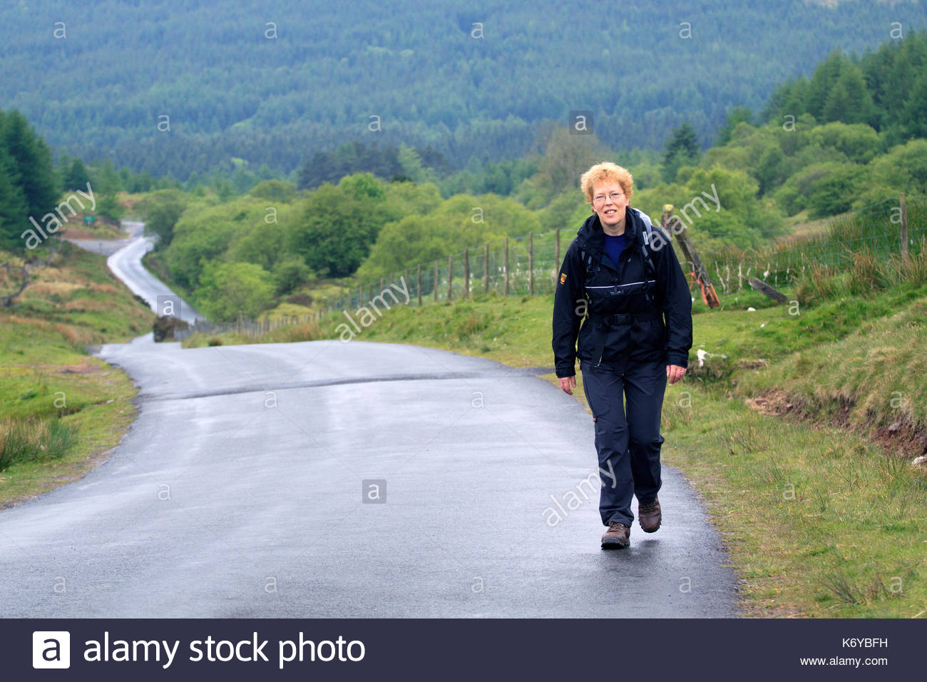 Woman Walking Up Steep Hill High Resolution Stock Photography and ...