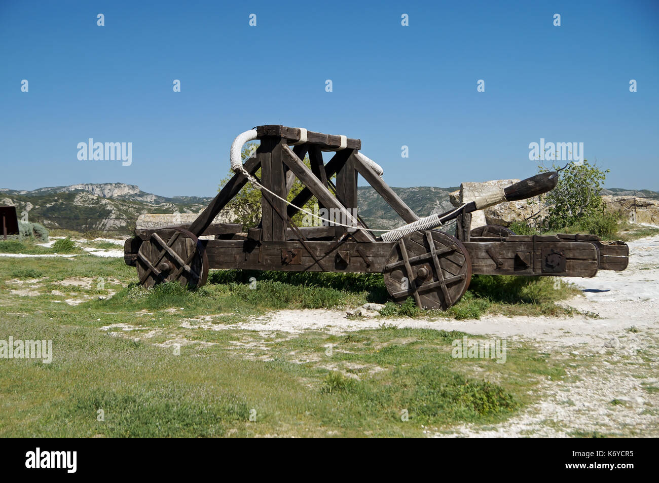 Middle age catapult used as medieval siege engine against castles Stock Photo