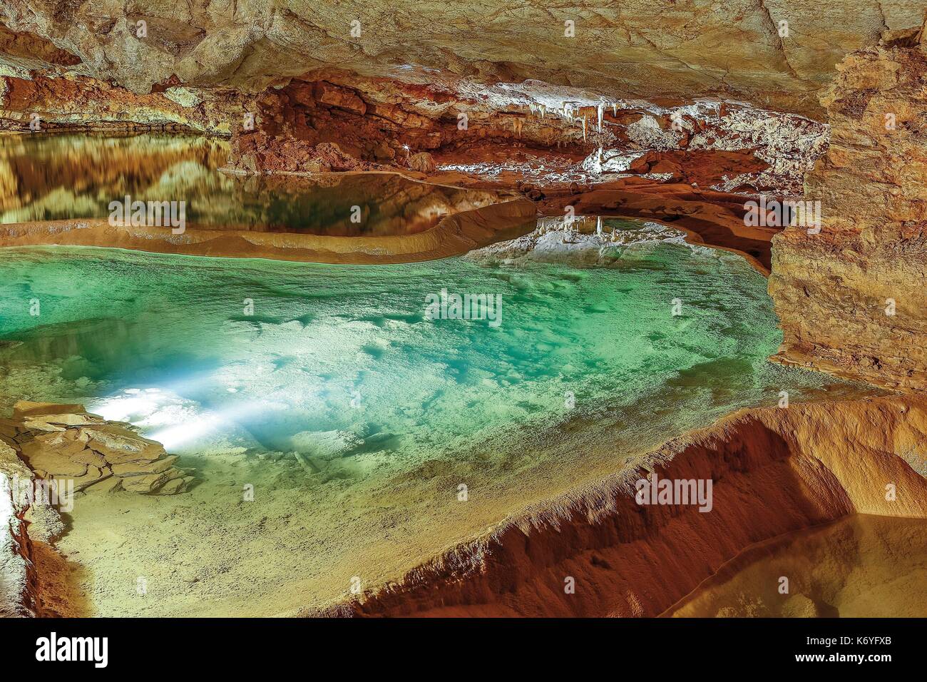 France, Lot, listed at Great Tourist Sites in Midi Pyrenees, Padirac, Padirac gulf, Natural regional park Causses du Quercy, gours lit in green at the bottom of the cave Stock Photo