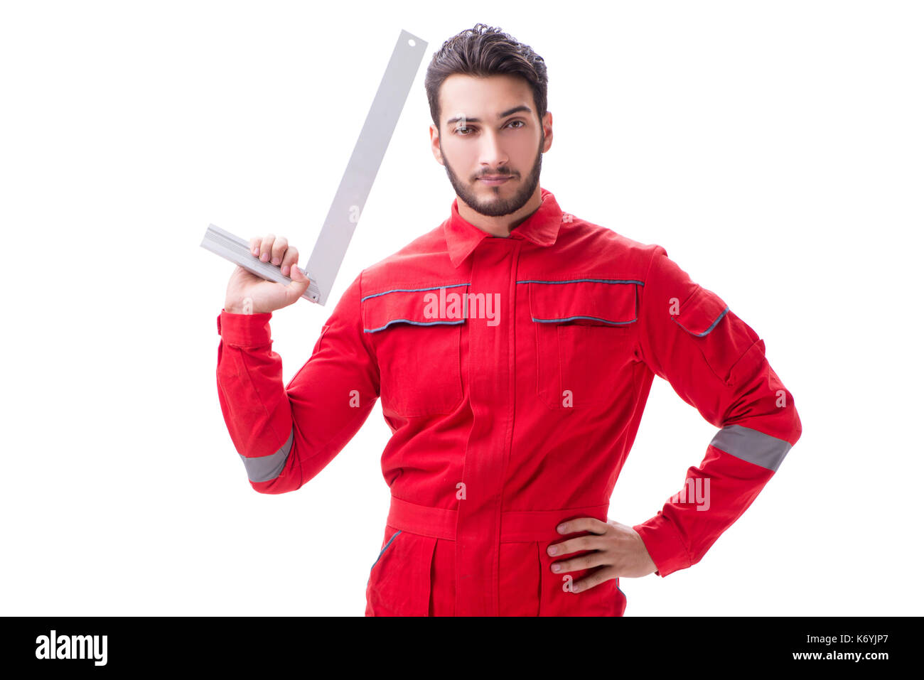 Young repairman with a square ruler isolated on white background Stock ...