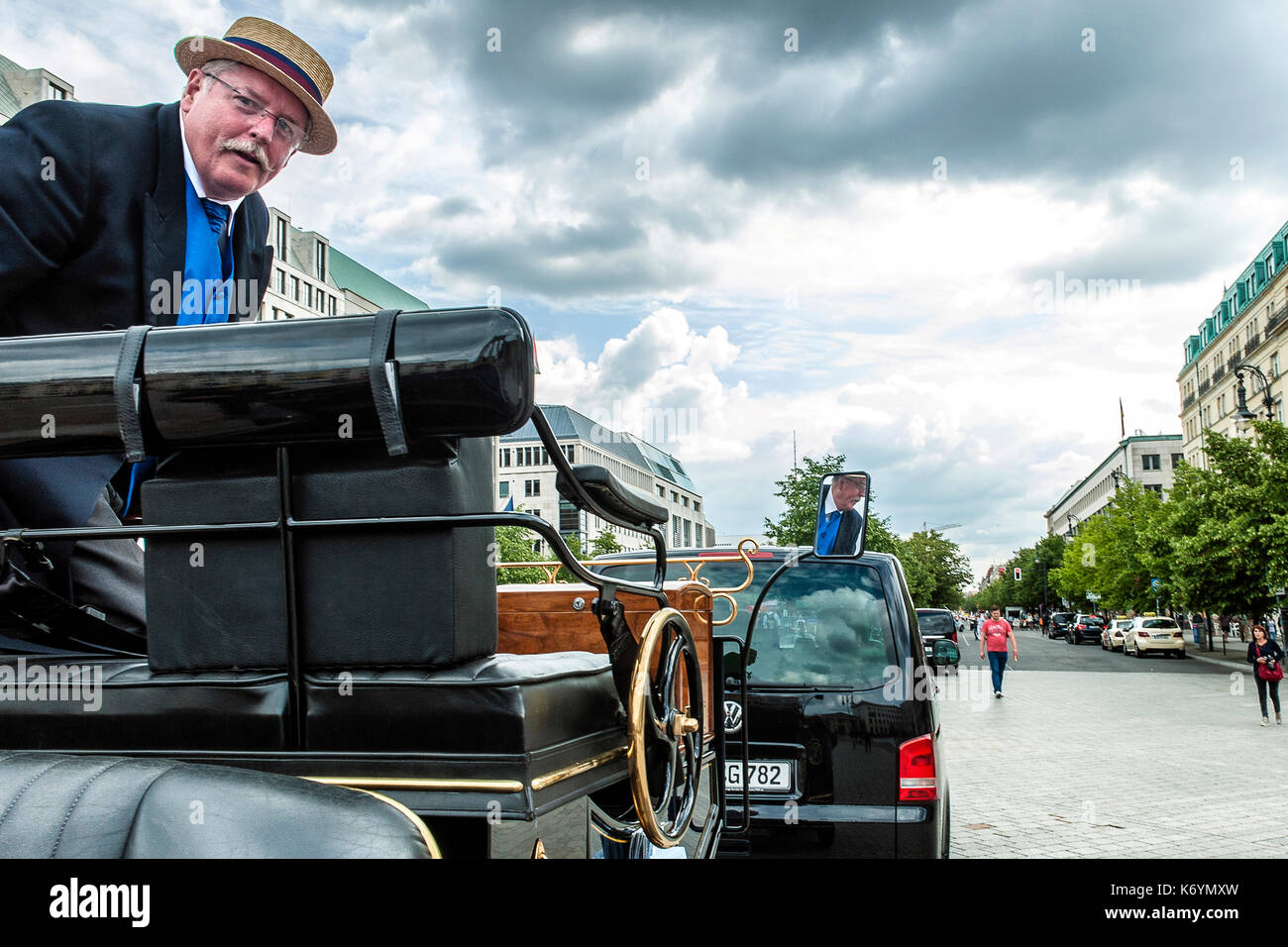 Germany Vintage style car with driver dressed in typical uniform, in Pariser Platz, Berlin Stock Photo