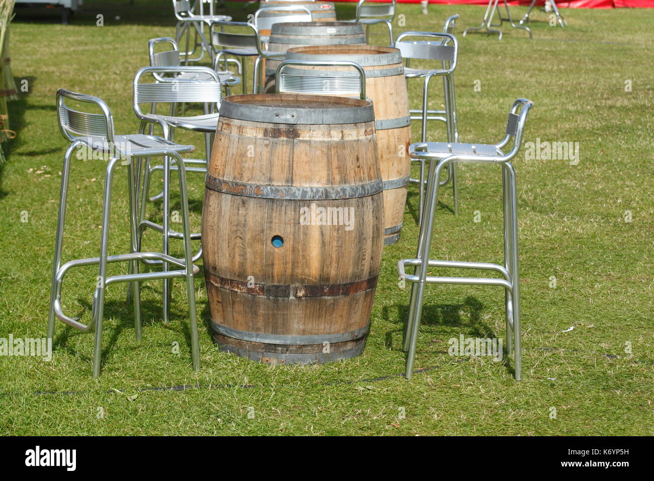wooden barrel table and metal chairs on a meadow Stock Photo Alamy