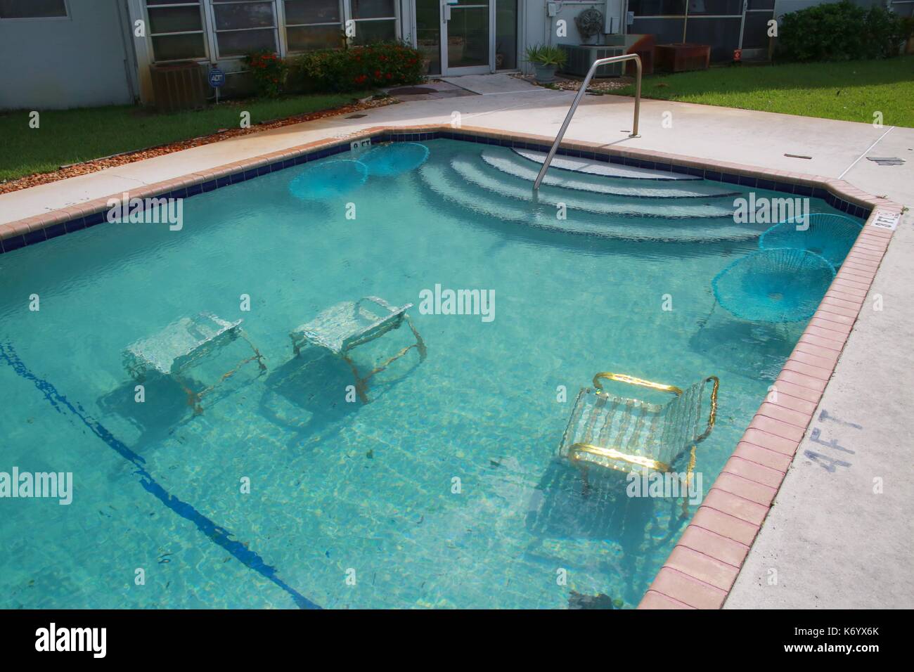 Deck Furniture at Crystal Lake Condominiums Intentionally Submerged in