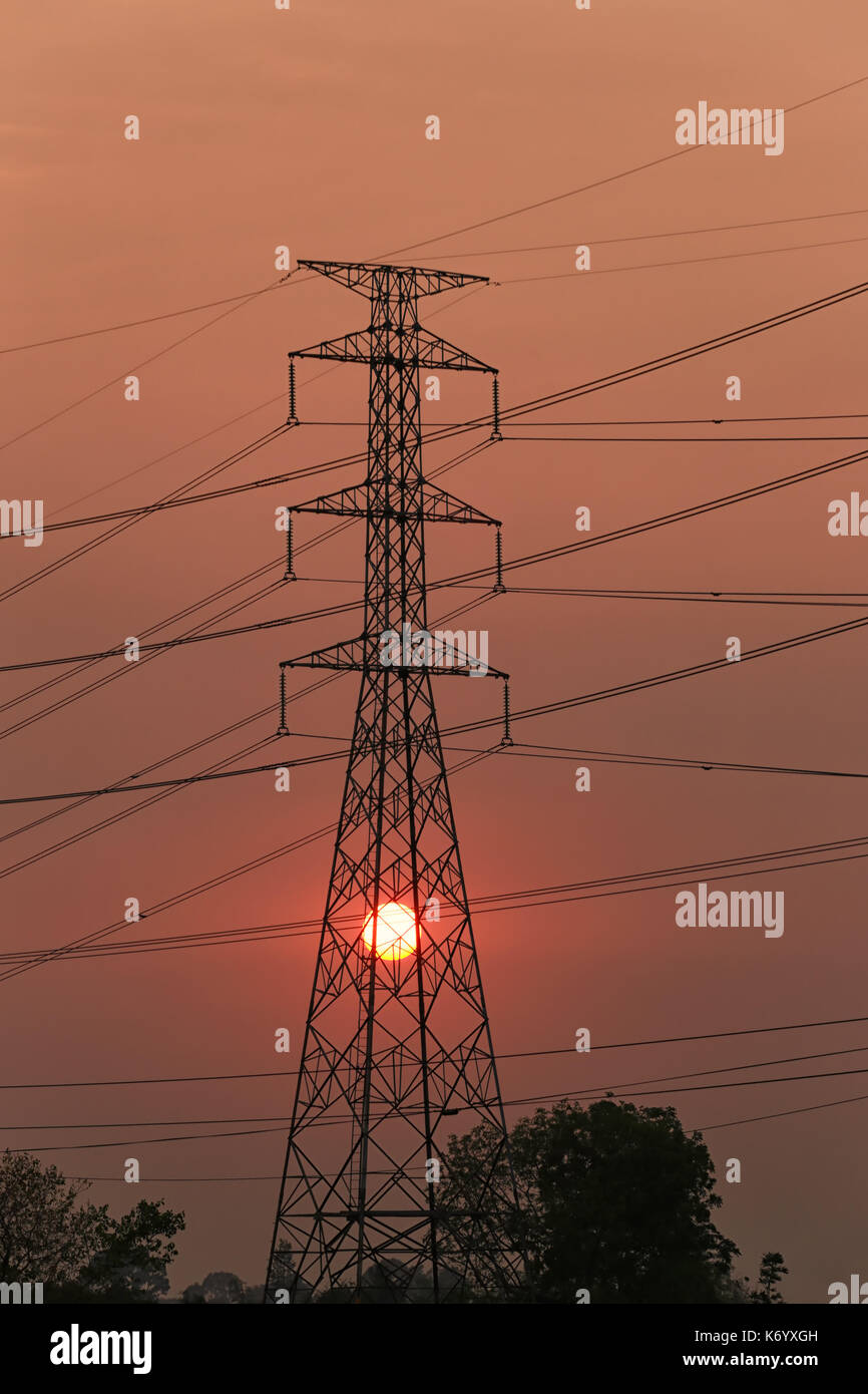 High voltage towers and sunset in Energy concept,Photography Silhouette. Stock Photo