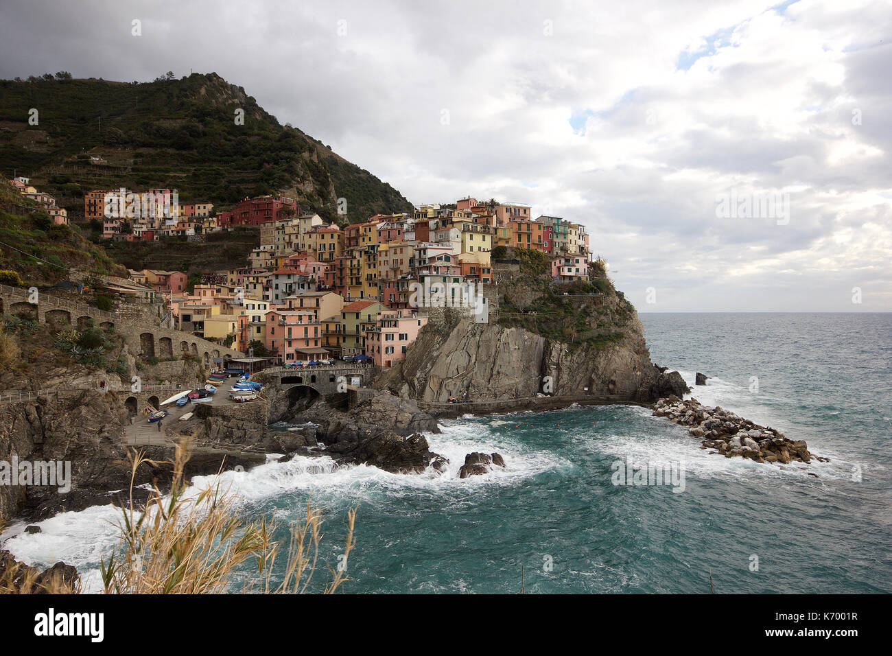 the beautiful pastel colored houses of Manarola, Le Cinque Terre, Italy, from a distance, photoarkive Stock Photo