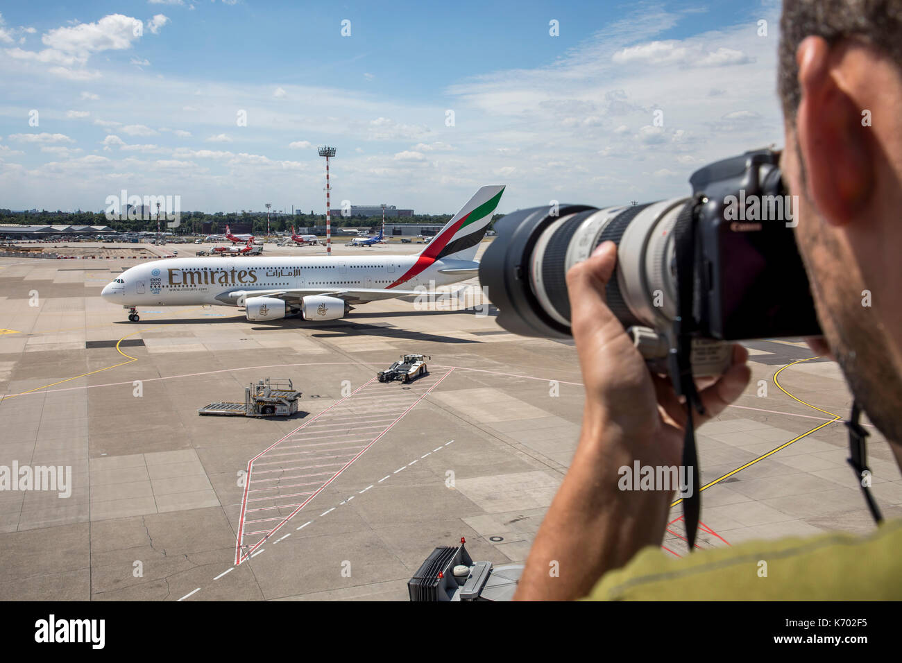 DŸsseldorf International Airport, Germany, Emirates Airbus A380-800 on taxiway, plane spotter on the observation deck, Stock Photo