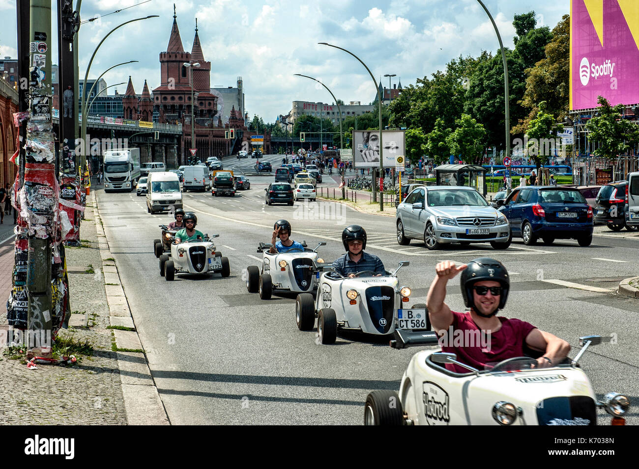 A group of small racing cars travels along Warschauer Strasse, in Berlin Stock Photo