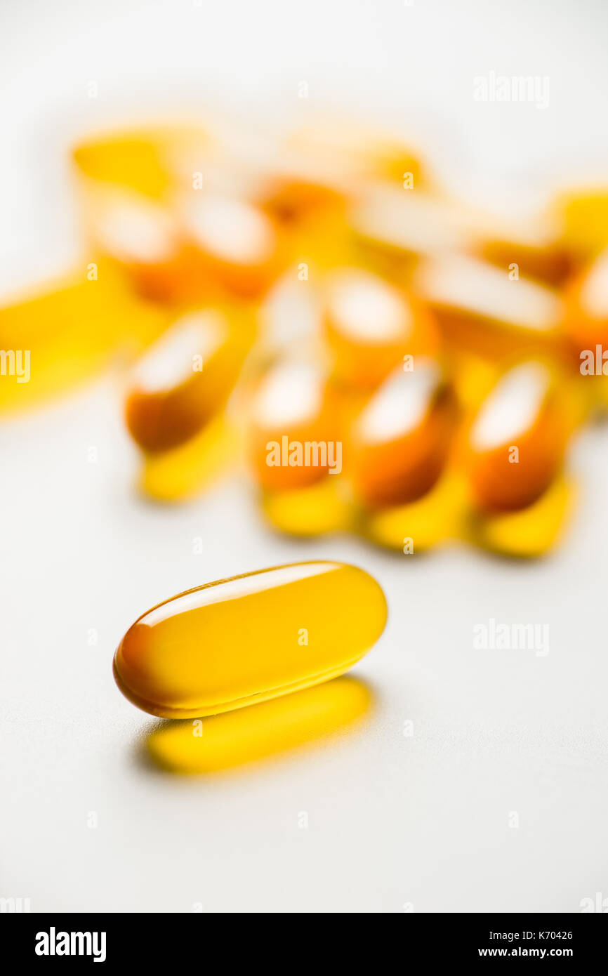 Vitamin e. Fish oil capsules on white background. Copy space for your