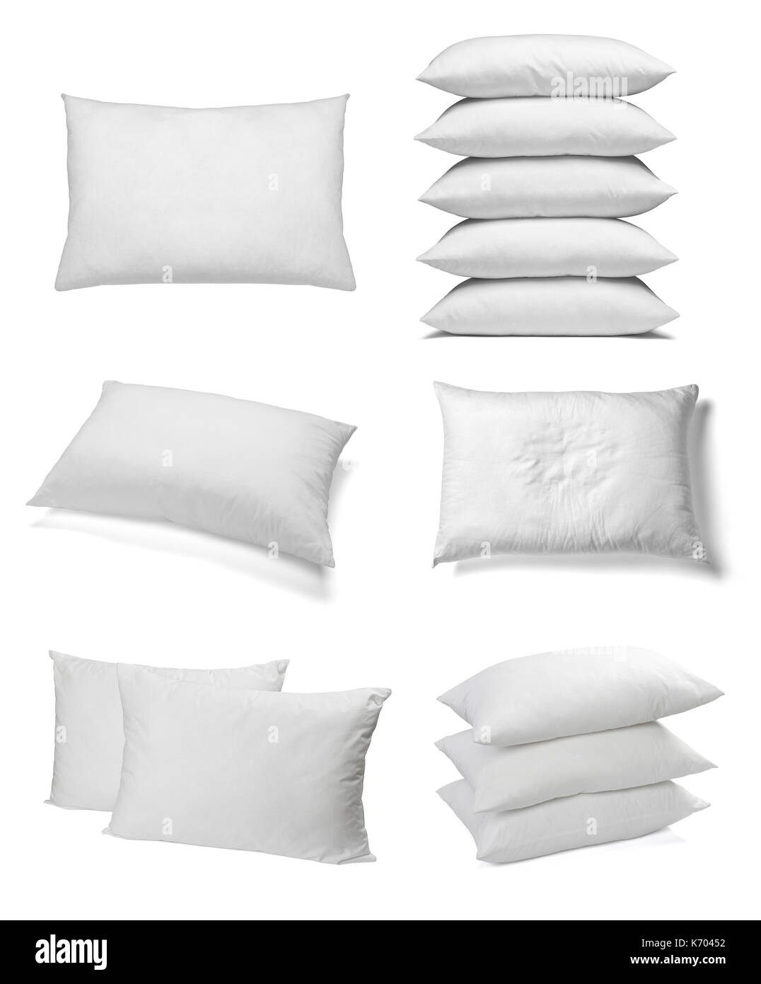 collection of various white pillows on white background. each one is