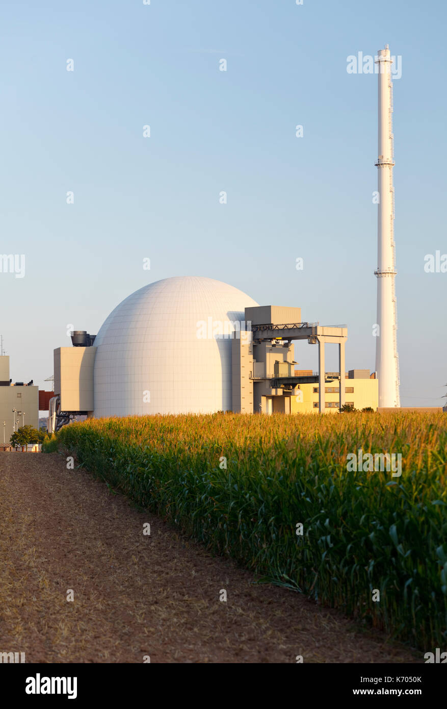 Reactor building of a nuclear power station, a corn field in the foreground. Stock Photo
