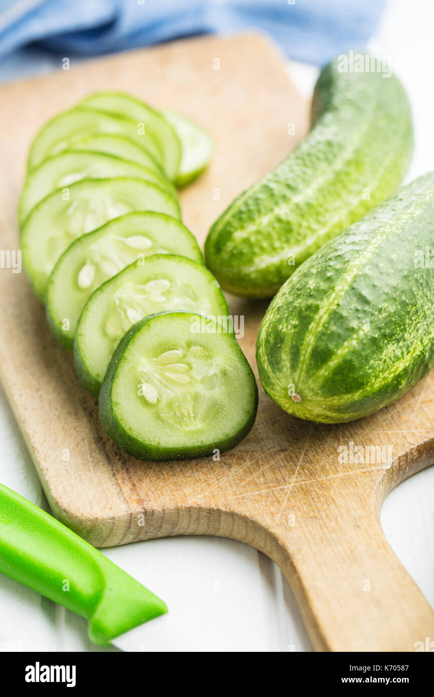 Sliced green cucumbers. Cucumbers on cutting board. Stock Photo