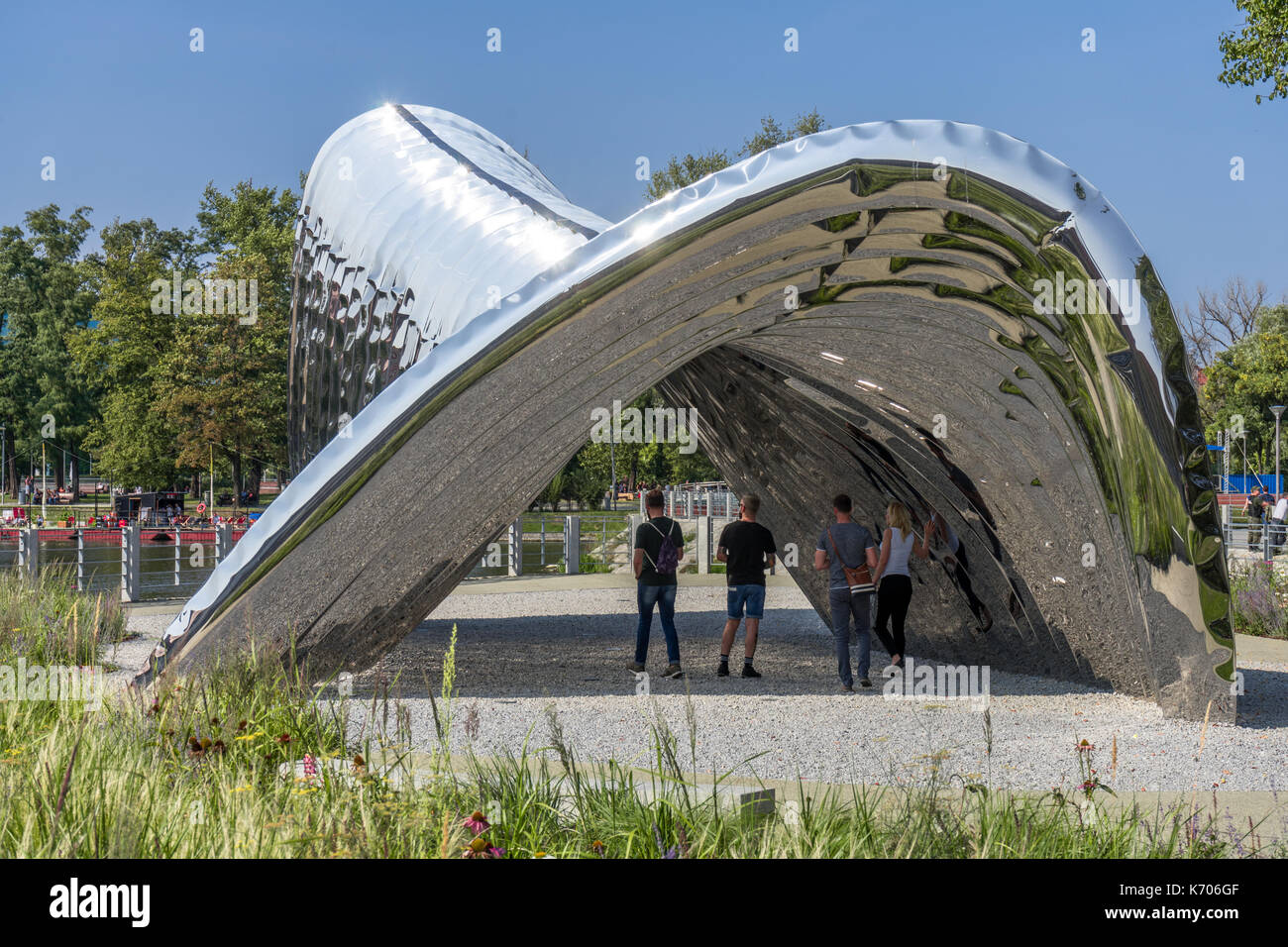 People inside the city sculpture called NAWA designed by Oskar Zięta on Daliowa island in downtown Wroclaw in 2017, Poland Stock Photo