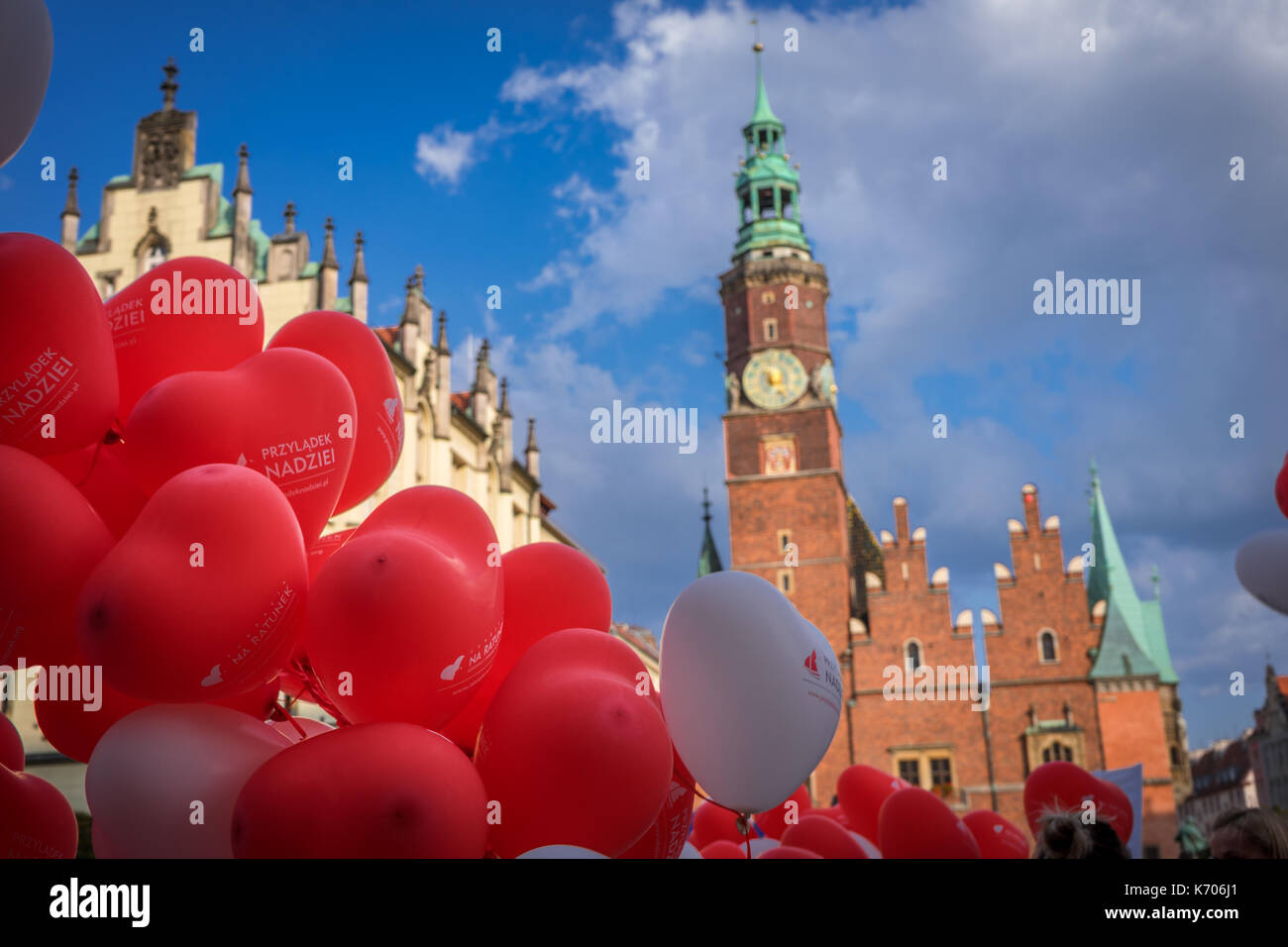 Balloons in red and white -  the Polish national colours with the Old Town Hall in the background, Wroclaw, Poland Stock Photo