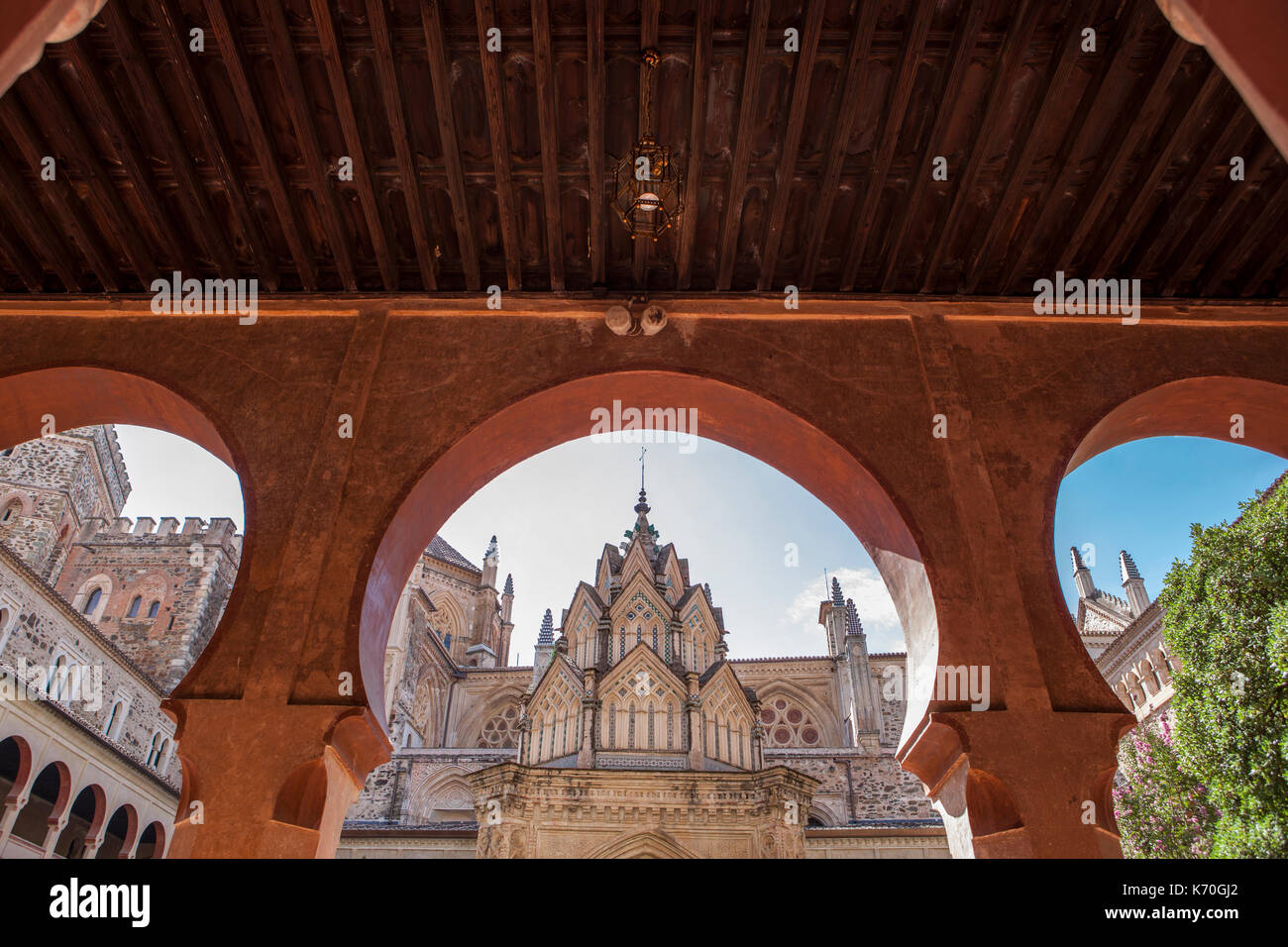 Guadalupe Monastery cloister from open arcade. Mudejar arches detail. Caceres, Spain Stock Photo