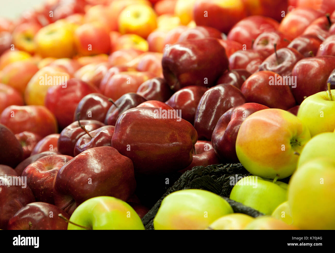 focus on beautiful fresh red apples at a market stand Stock Photo