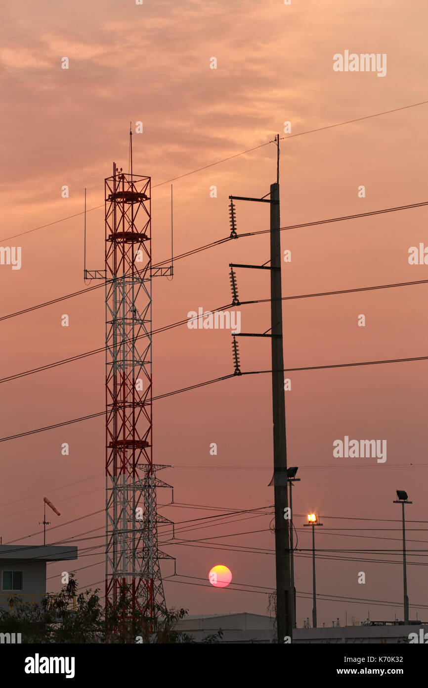 High voltage towers and sunset in Energy concept,Photography Silhouette. Stock Photo