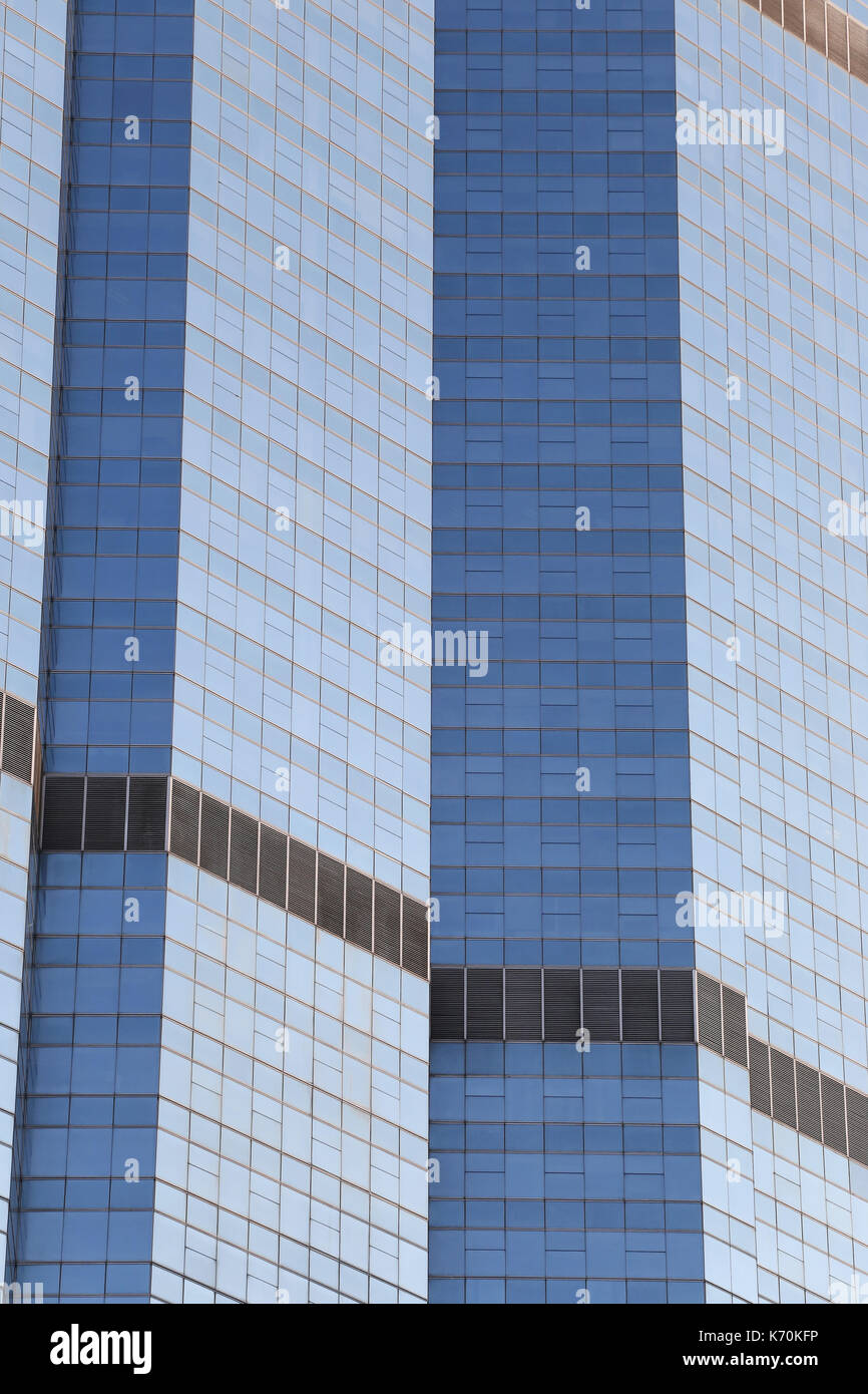Wall of tall building or glass of skyscraper background for design in your work backdrop. Stock Photo
