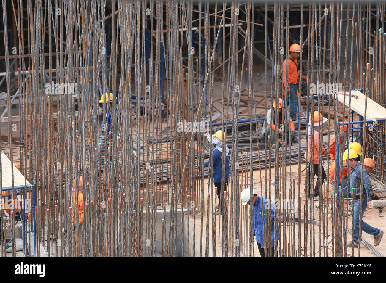 Construction site and Worker is working in Tall buildings Stock Photo ...