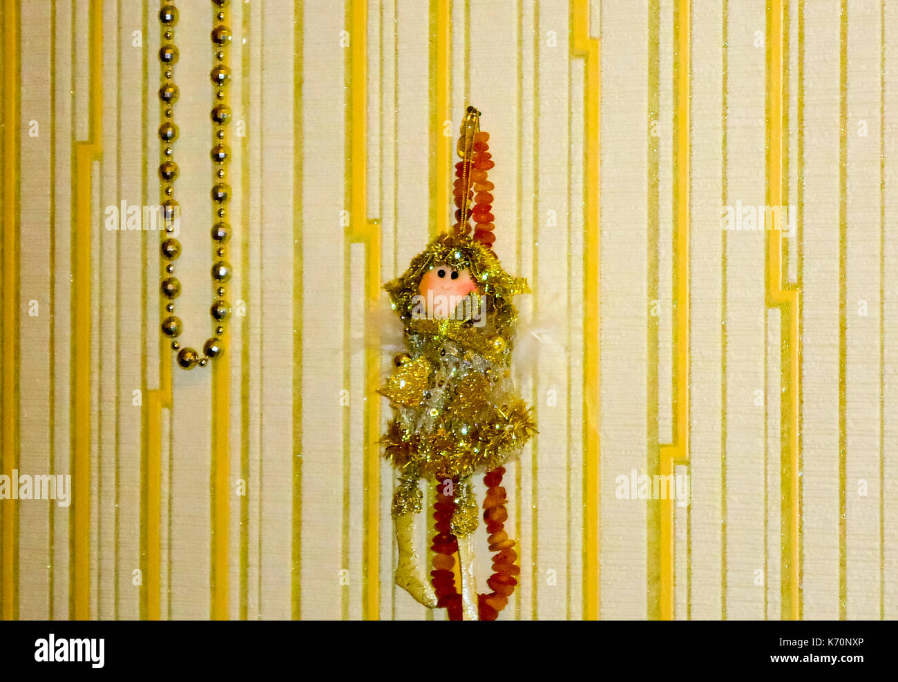 handmade doll hanging on the wall. beads on the wall Stock Photo Alamy