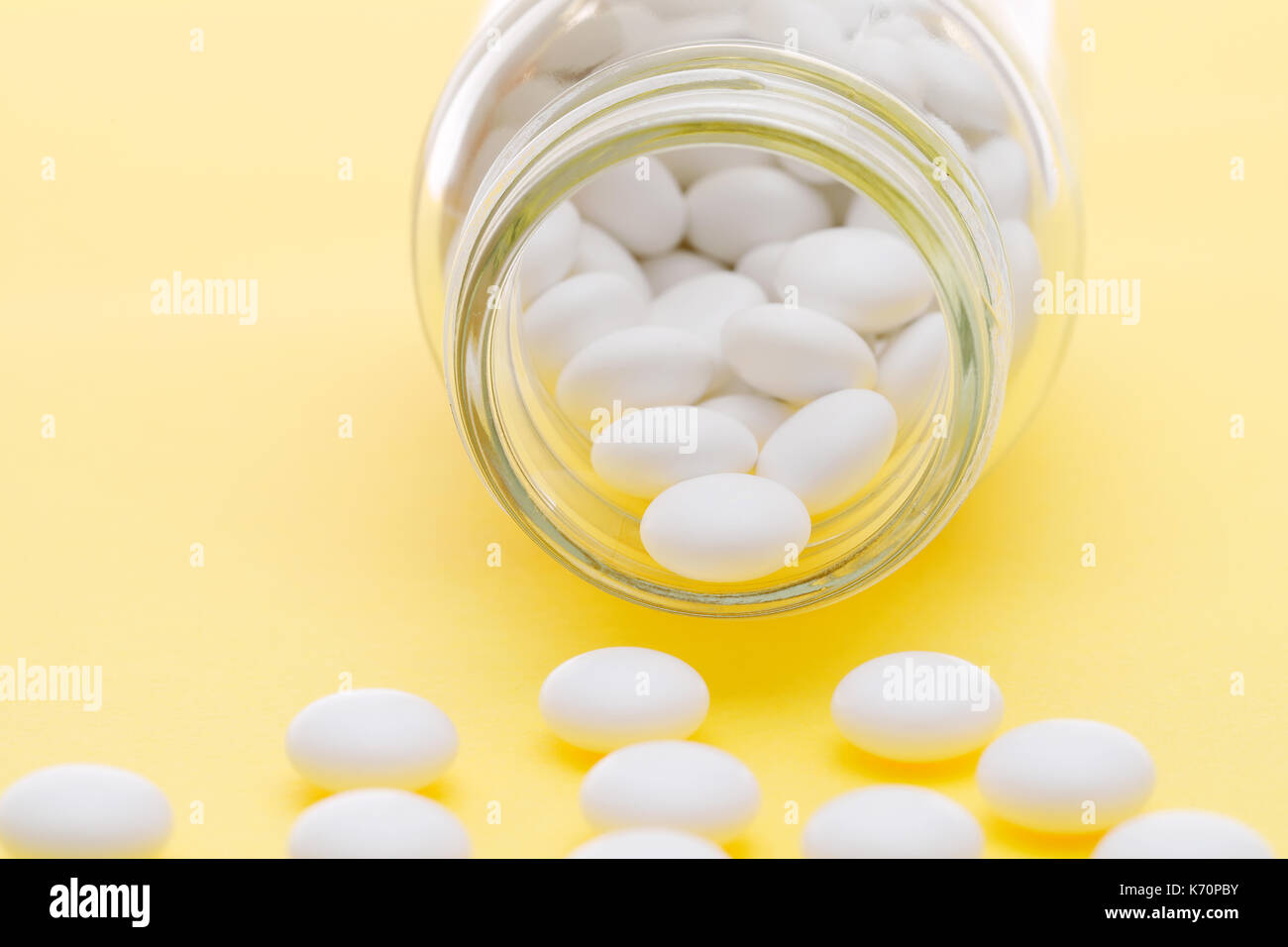 Glass Bottle And Pills On Light Yellow Background Stock Photo Alamy