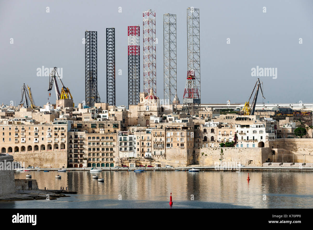 Jackup oil drilling rigs juxtaposed with the Senglea waterfront in