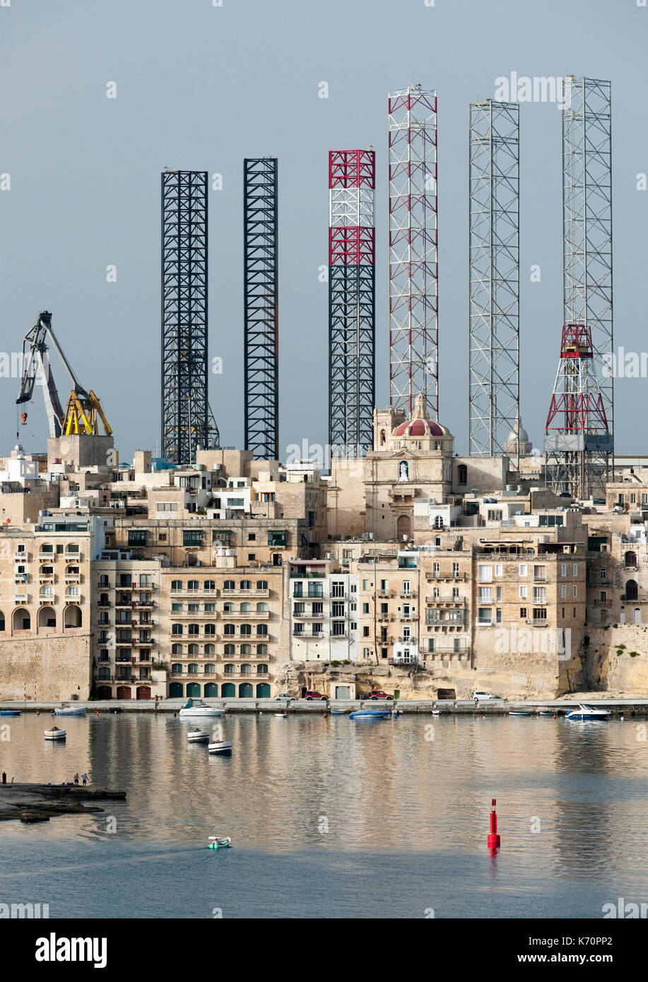 Jackup oil drilling rigs juxtaposed with the Senglea waterfront in